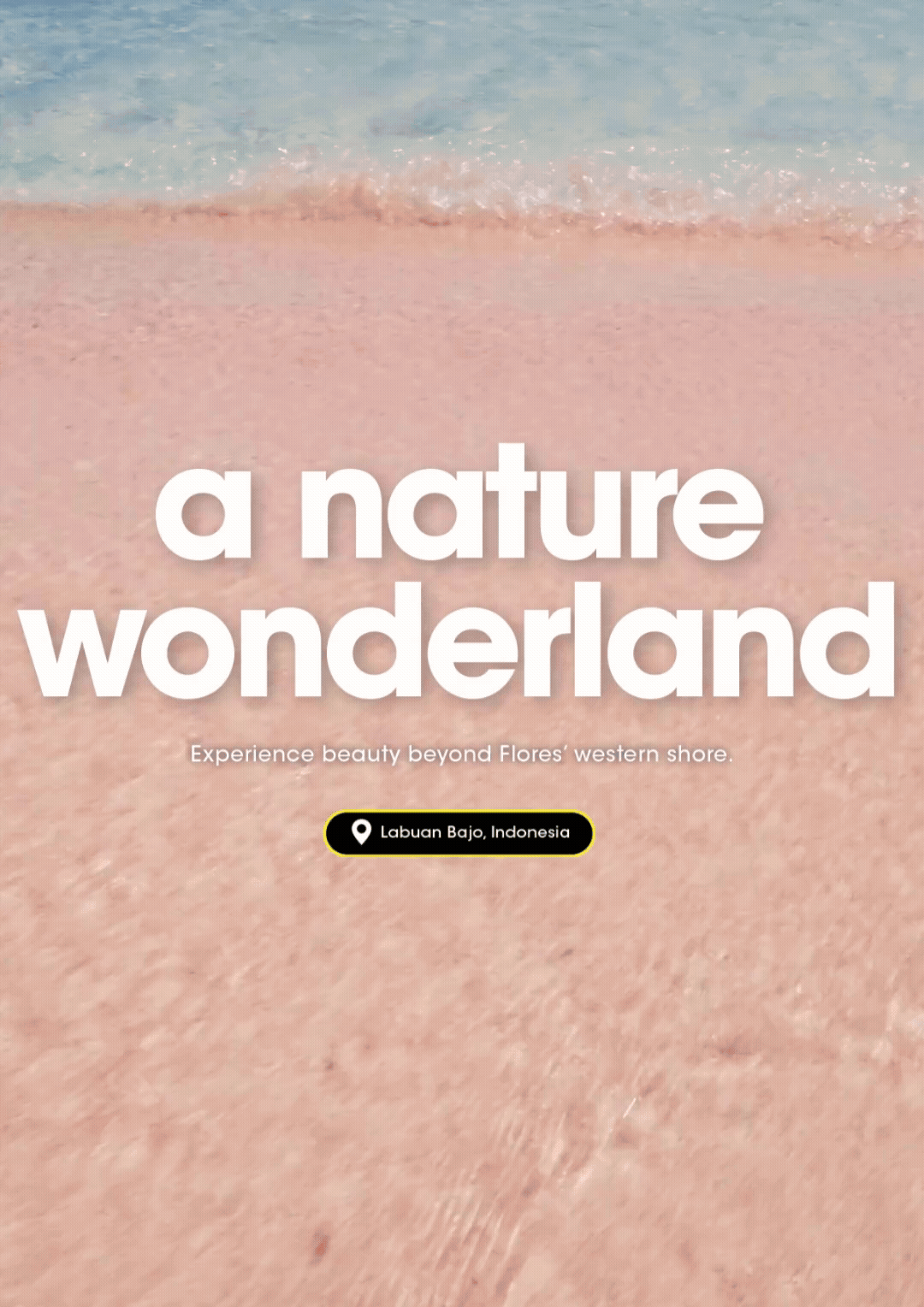 Pink sandy beach and crashing waters of turquoise ocean on the island of Labuan Bajo, Indonesia