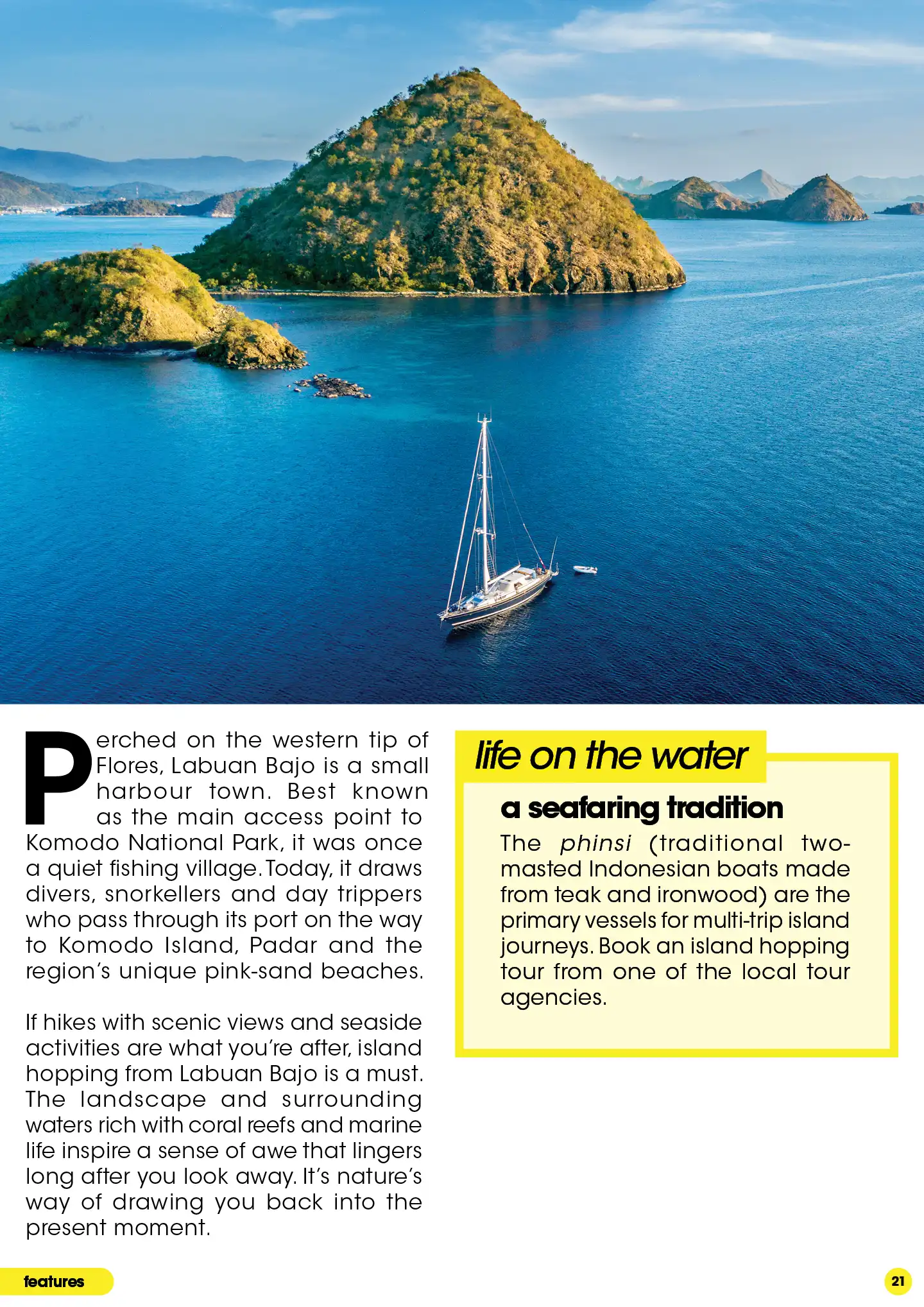 Sailboat in blue ocean near small harbour town, Labuan Bajo
