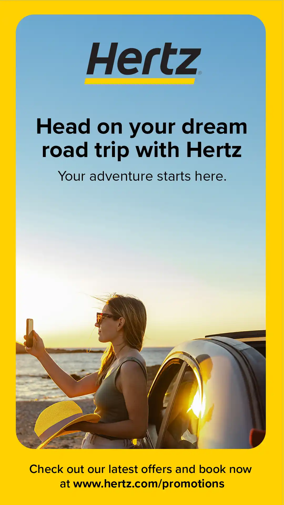 Advertisement for Hertz shows a woman beside a car, taking a photo on a beach during golden hour.